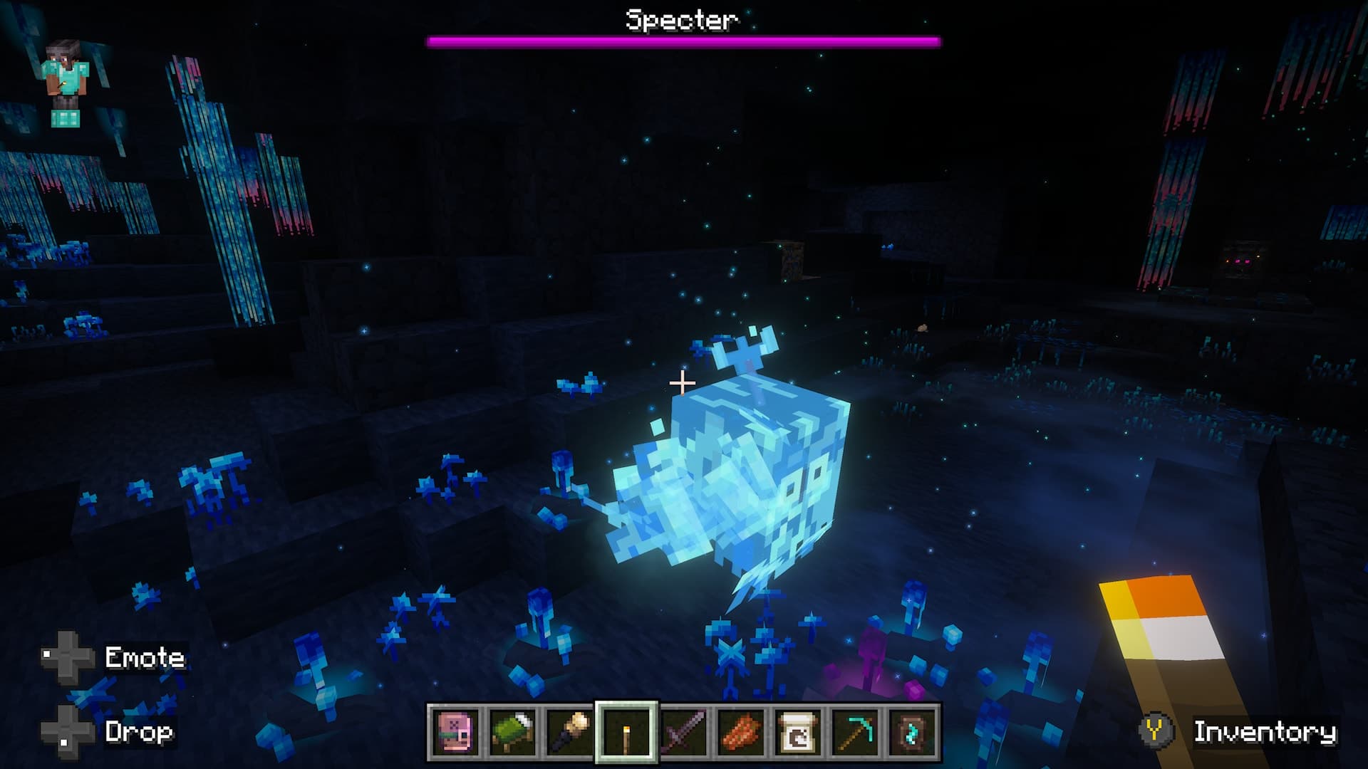 Minecraft player faces a glowing blue Specter creature surrounded by blue plants in a dark bioluminescent cavern.